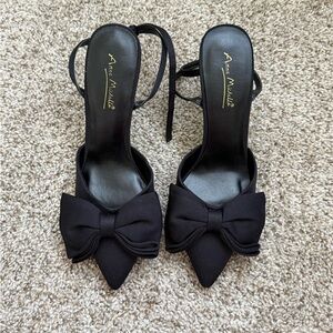 Black pointed toe heels